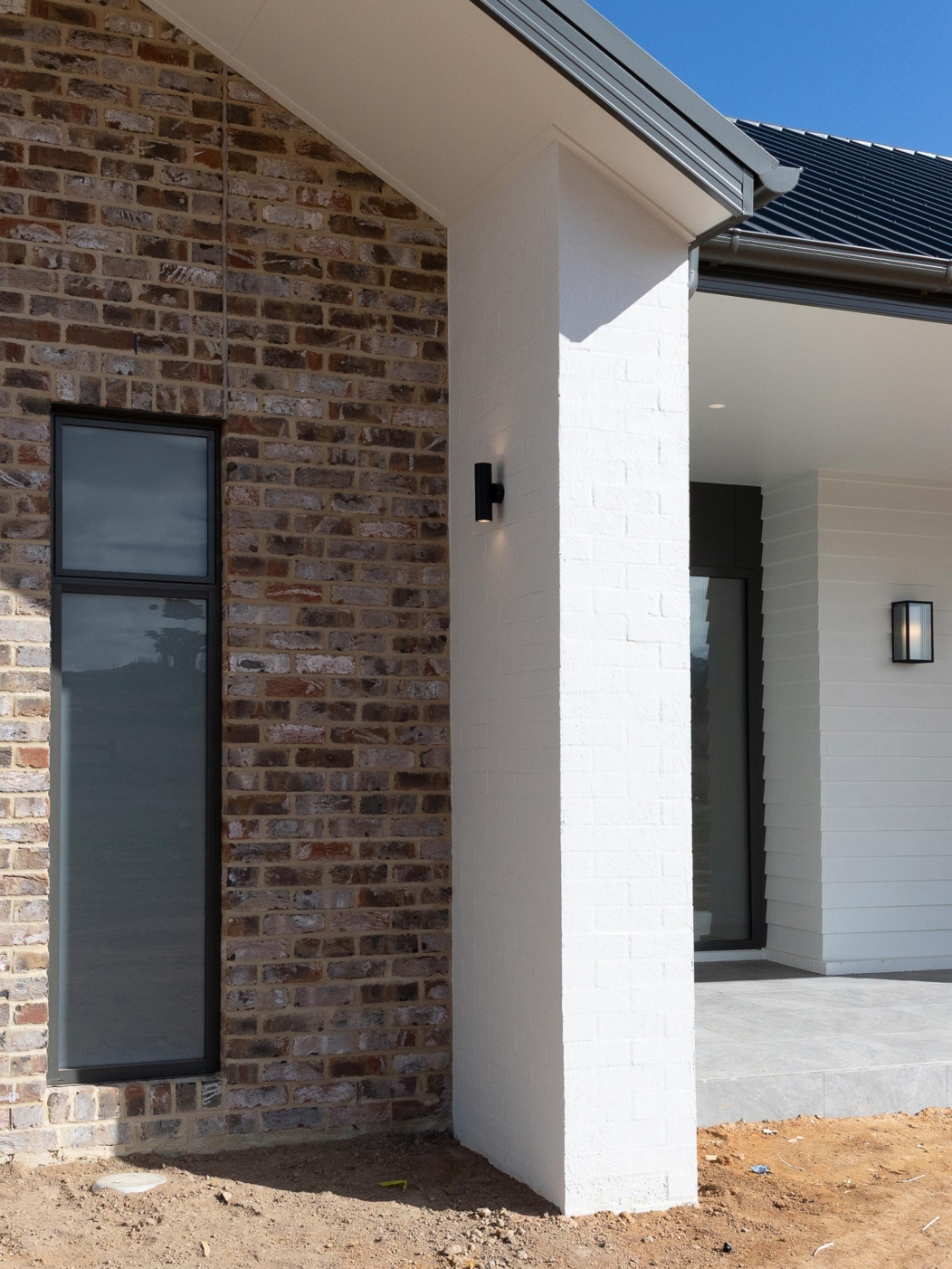 Brick and white-clad home exterior with covered entrance, 14 Blakelys Close Project, Sutton ACT
