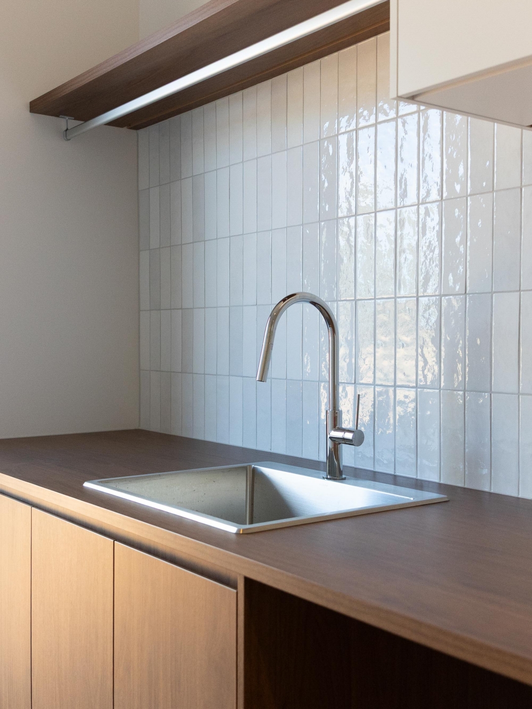 Timber kitchenette with stainless steel sink and white tiled splashback, 14 Blakelys Close Project, Sutton ACT